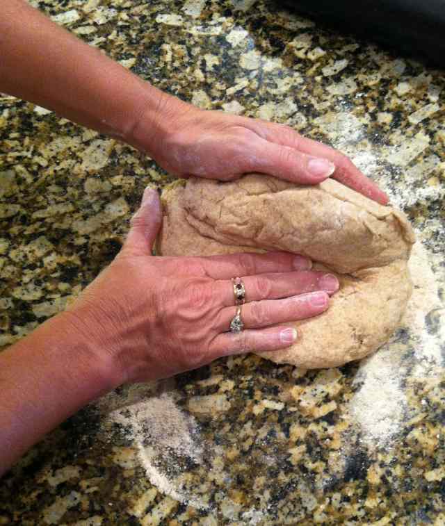 Folding buttermilk biscuit dough with hands