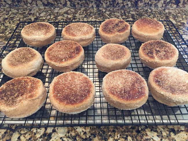 Cooked English muffins on cooling rack
